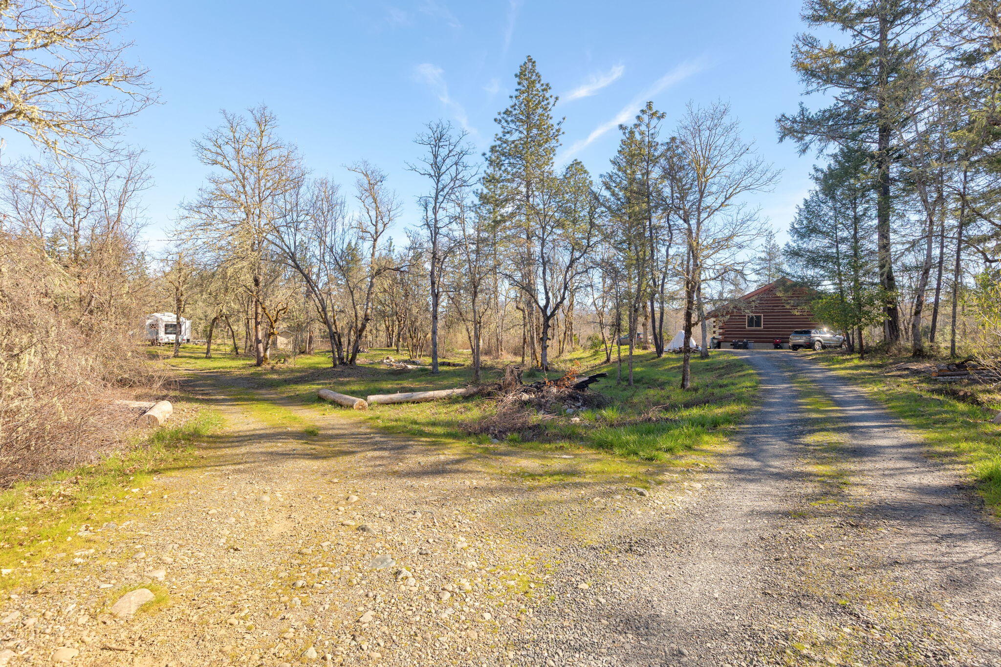 5737 Rockydale Road Cave Junction, OR 97523 - Photo 28 of 39 a view of road with large trees