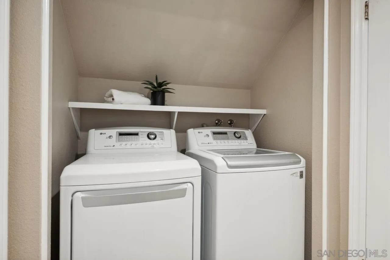 7914 Corte Cardo Carlsbad, CA 92009 - Photo 26 of 61 a utility room with dryer and washer
