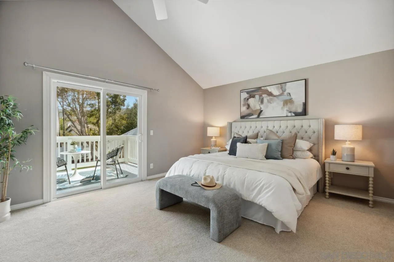 7914 Corte Cardo Carlsbad, CA 92009 - Photo 30 of 61 a bedroom with a bed and large window