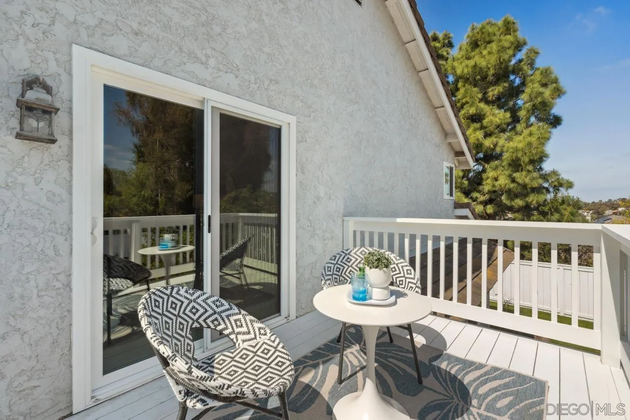 7914 Corte Cardo Carlsbad, CA 92009 - Photo 37 of 61 a view of a chair and table in the balcony