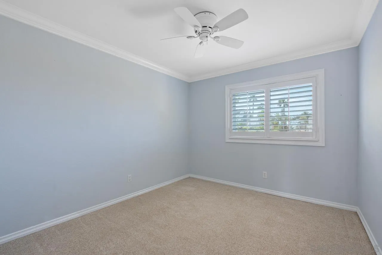 7914 Corte Cardo Carlsbad, CA 92009 - Photo 38 of 61 an empty room with a window and a fan