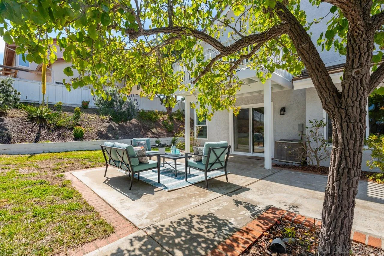 7914 Corte Cardo Carlsbad, CA 92009 - Photo 42 of 61 a view of a house with backyard porch and sitting area