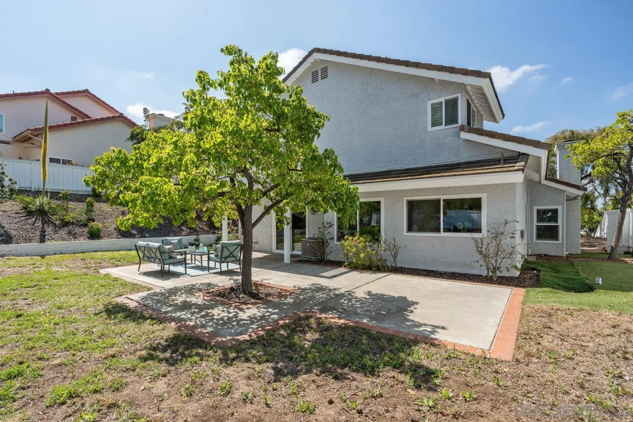 7914 Corte Cardo Carlsbad, CA 92009 - Photo 48 of 61 a view of a house with a yard and sitting area