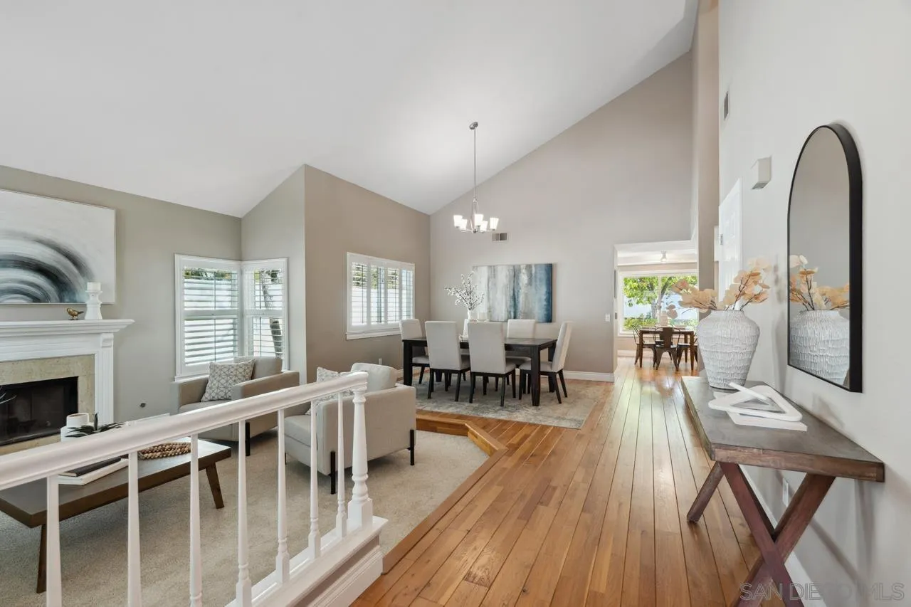 7914 Corte Cardo Carlsbad, CA 92009 - Photo 5 of 61 a view of a a dining room with furniture window and wooden floor