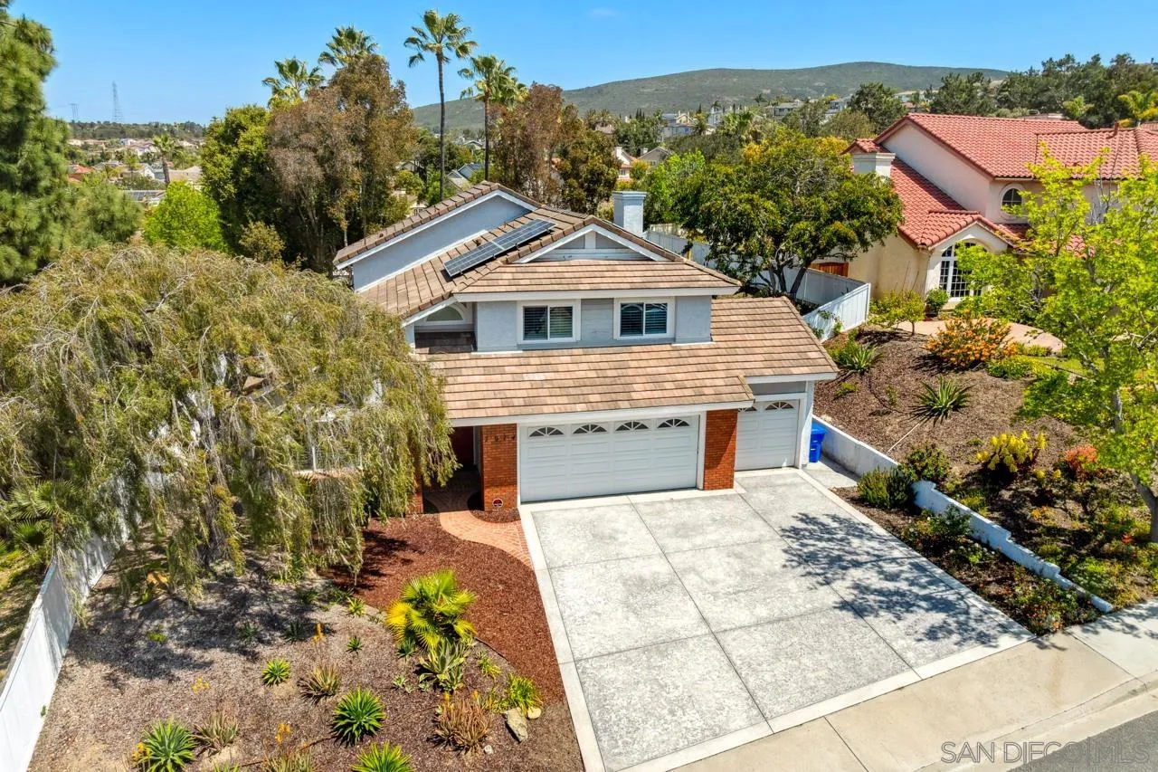 7914 Corte Cardo Carlsbad, CA 92009 - Photo 51 of 61 a view of a house with a yard