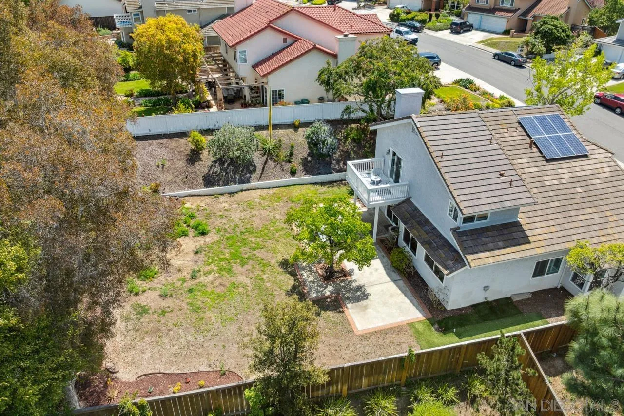 7914 Corte Cardo Carlsbad, CA 92009 - Photo 55 of 61 an aerial view of a house with a swimming pool