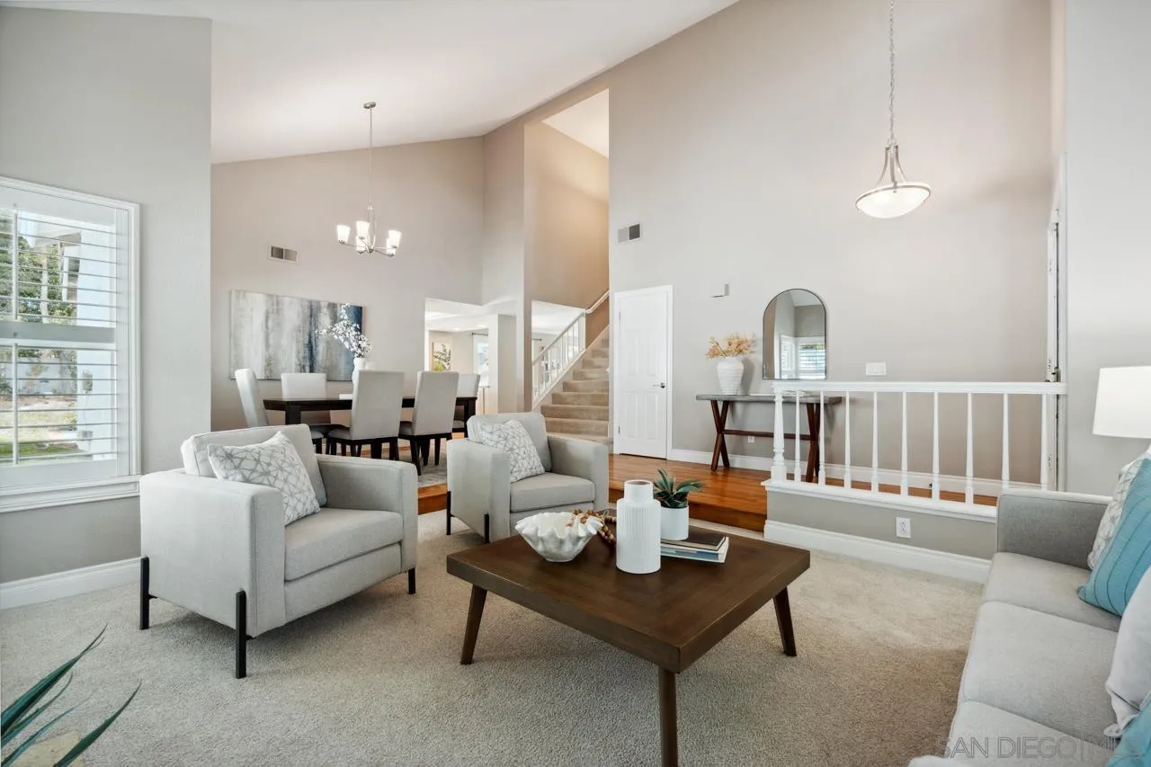 7914 Corte Cardo Carlsbad, CA 92009 - Photo 8 of 61 a living room with furniture and wooden floor
