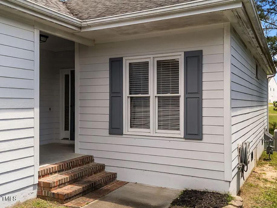 a view of a house with a door and wooden floor
