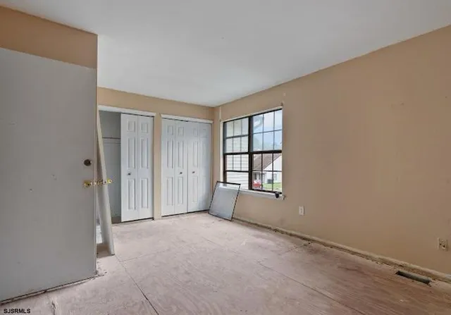 an empty room with windows