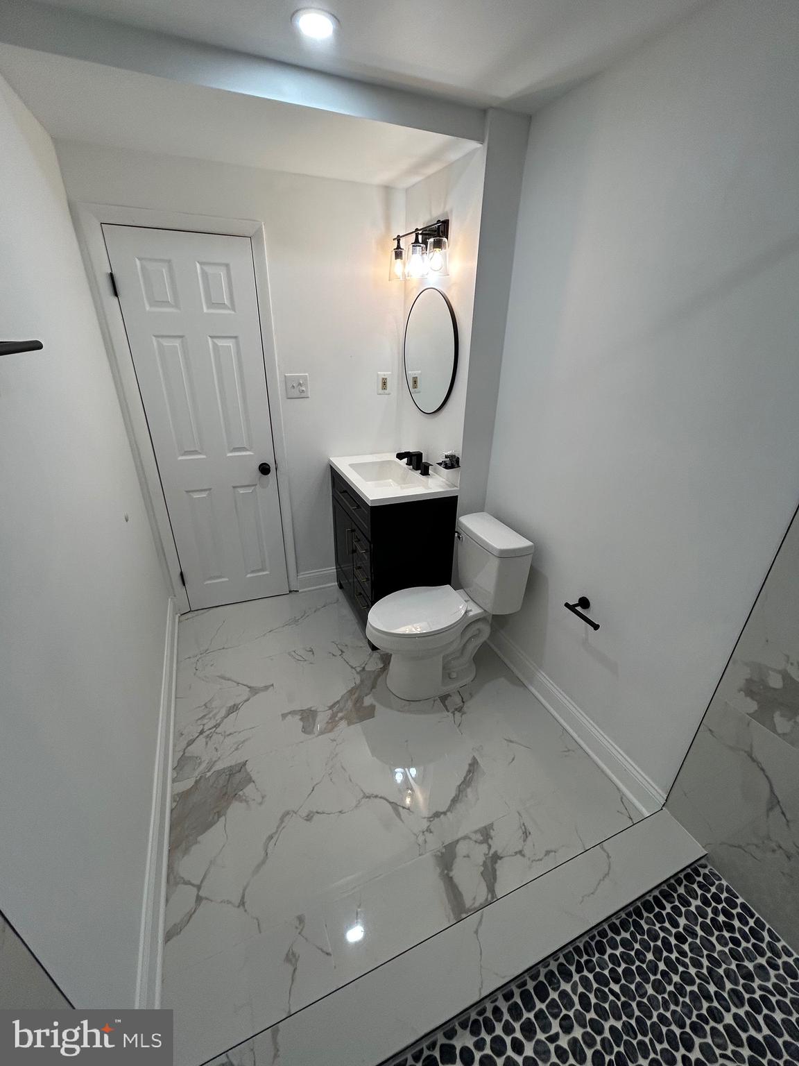 7036 Palamar Terrace Lanham, MD 20706 - Photo 12 of 34 a bathroom with a toilet and a mirror