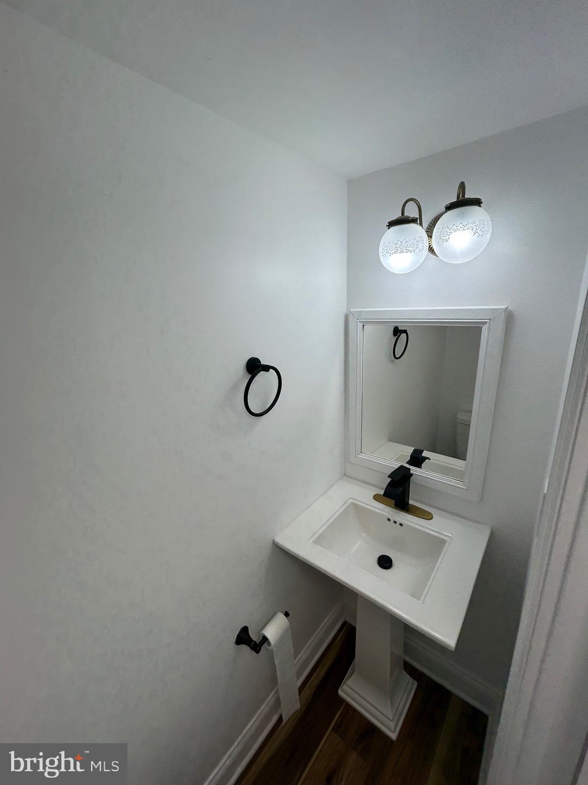 7036 Palamar Terrace Lanham, MD 20706 - Photo 13 of 34 a bathroom with a sink and a mirror