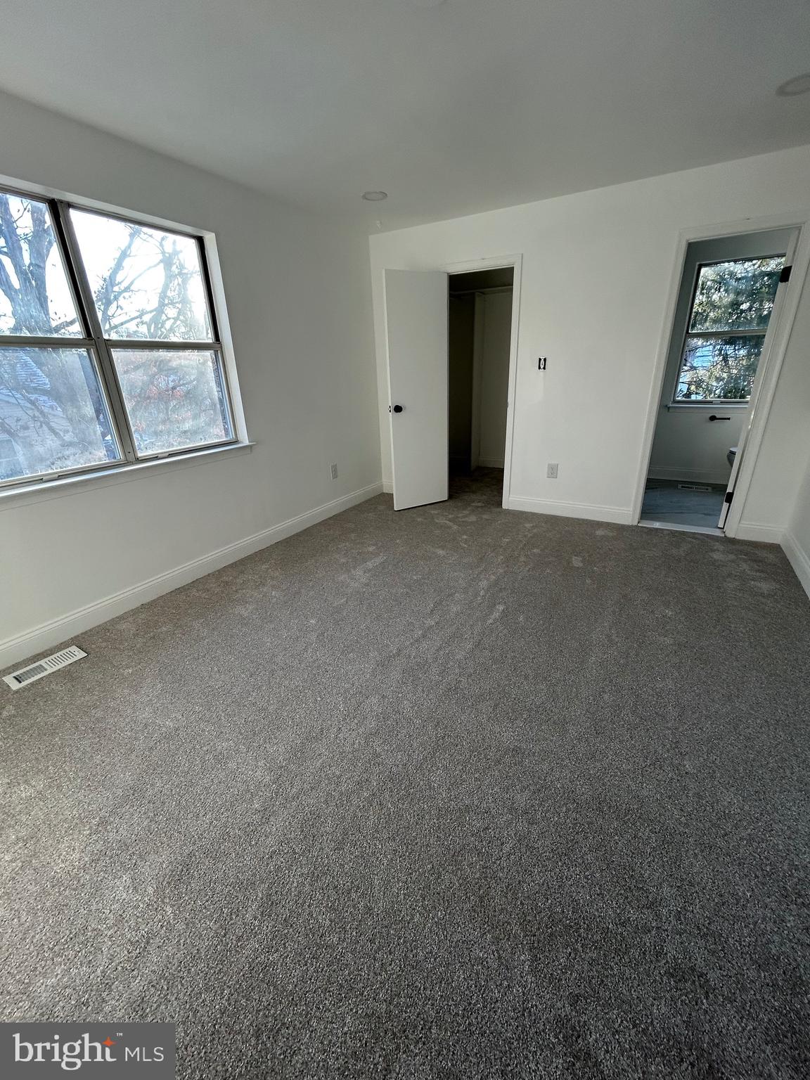 7036 Palamar Terrace Lanham, MD 20706 - Photo 29 of 34 an empty room with windows and closet