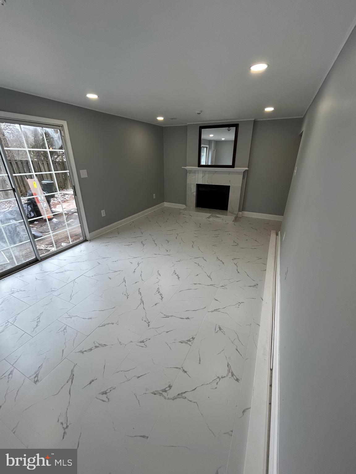 7036 Palamar Terrace Lanham, MD 20706 - Photo 32 of 34 a view of empty room with wooden floor and fireplace