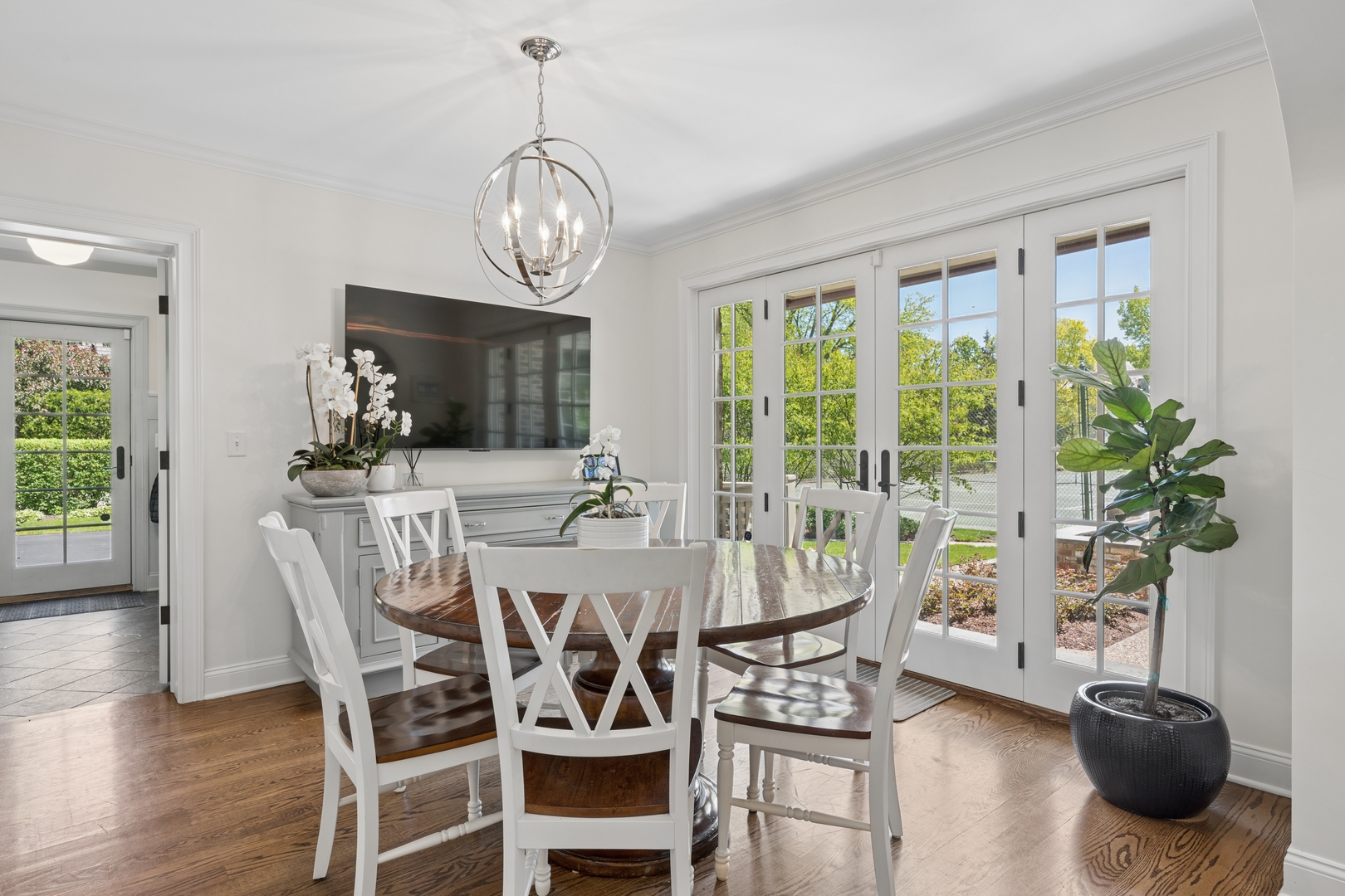 936 Sunset Road Winnetka, IL 60093 - Photo 21 of 50 a view of a dining room with furniture window and wooden floor