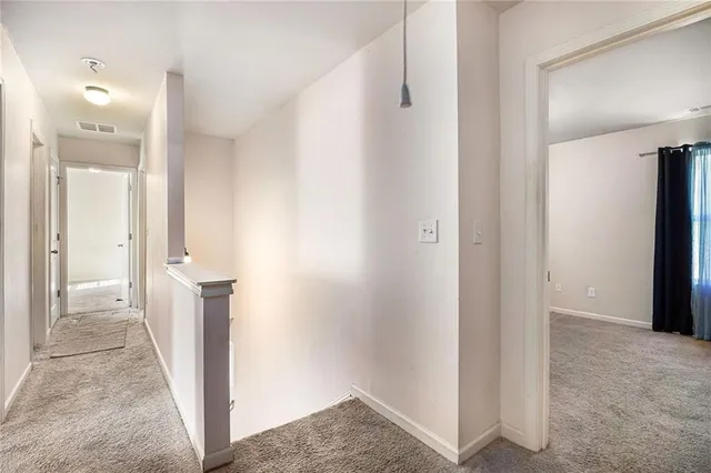 a view of a bathroom with sink and mirror