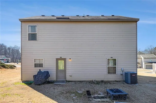 a front view of a house with sitting area