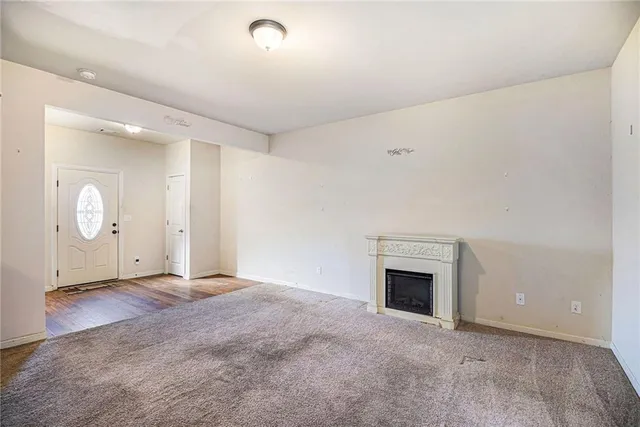 an empty room with fireplace