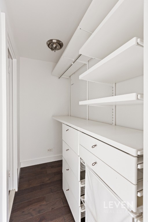 333 East 14th Street, Unit 9A Manhattan, NY 10003 - Photo 5 of 8 a view of cabinets and wooden floor