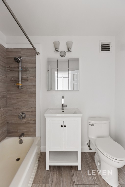 333 East 14th Street, Unit 9A Manhattan, NY 10003 - Photo 6 of 8 a bathroom with a sink a toilet and bathtub