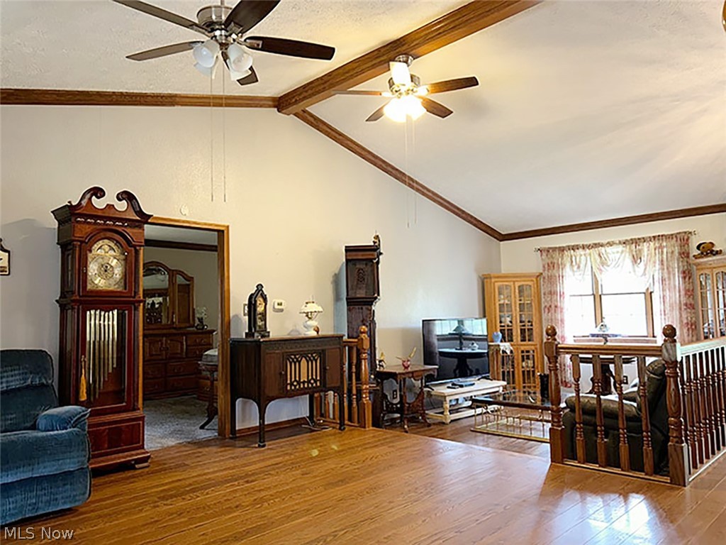 14987 Strader Road East Liverpool, OH 43920 - Photo 5 of 13 Living room with vaulted ceiling with beams, ceiling fan, and hardwood / wood-style flooring