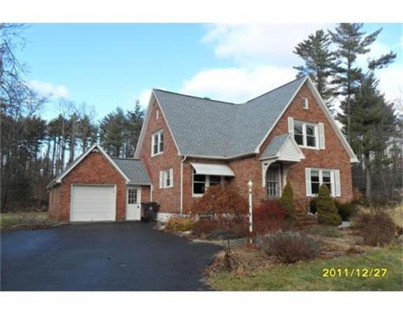116 Old Stage Road Westfield, MA 01085 - Photo 1 of 8 a front view of a house with a yard and garage
