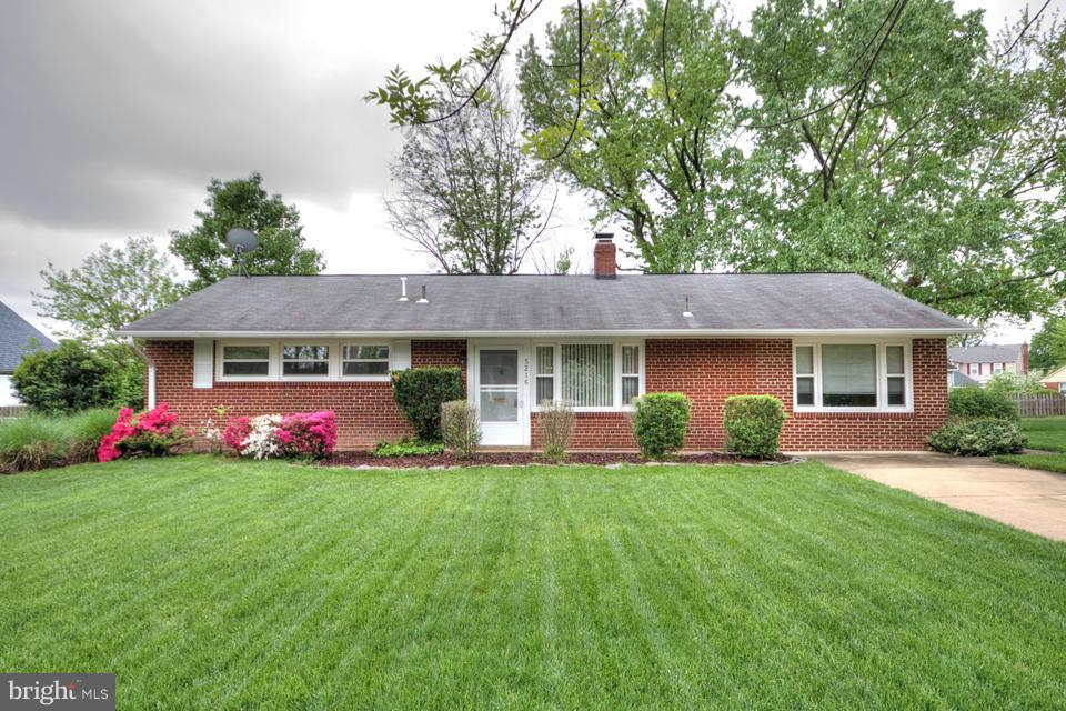 5216 Dalton Road Springfield, VA 22151 - Photo 1 of 27 a front view of a house with a yard and green space