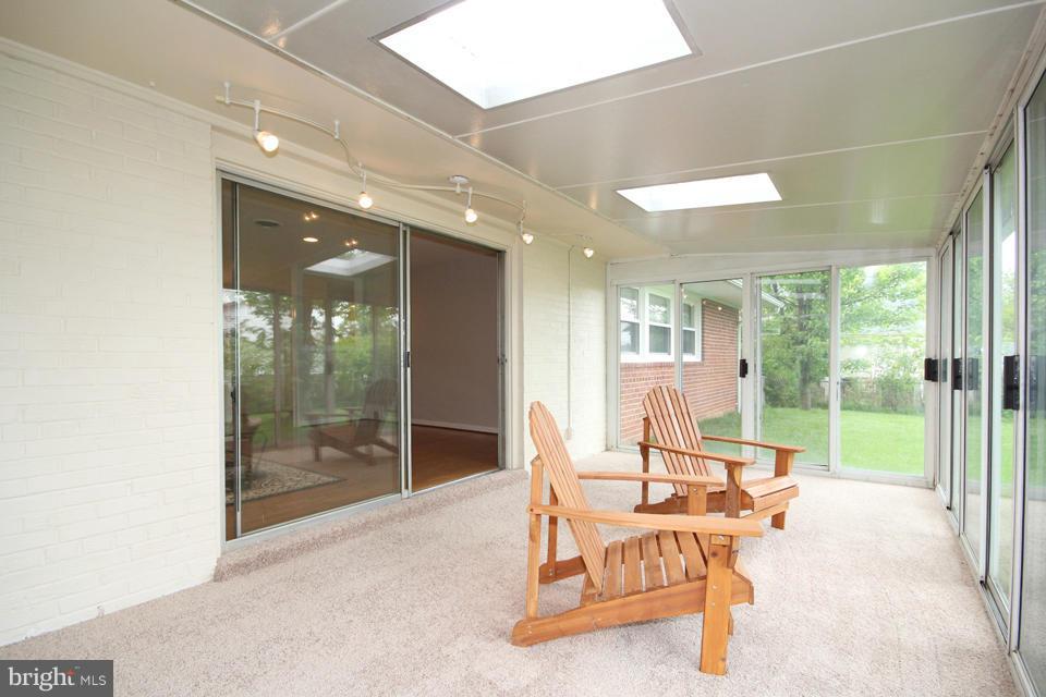 5216 Dalton Road Springfield, VA 22151 - Photo 17 of 27 a living room with furniture and large windows