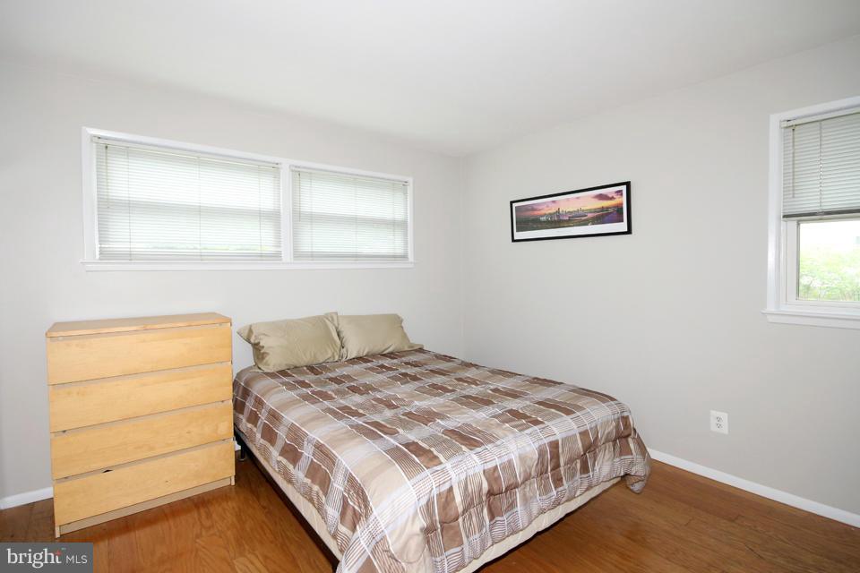 5216 Dalton Road Springfield, VA 22151 - Photo 18 of 27 a bedroom with a bed and a window