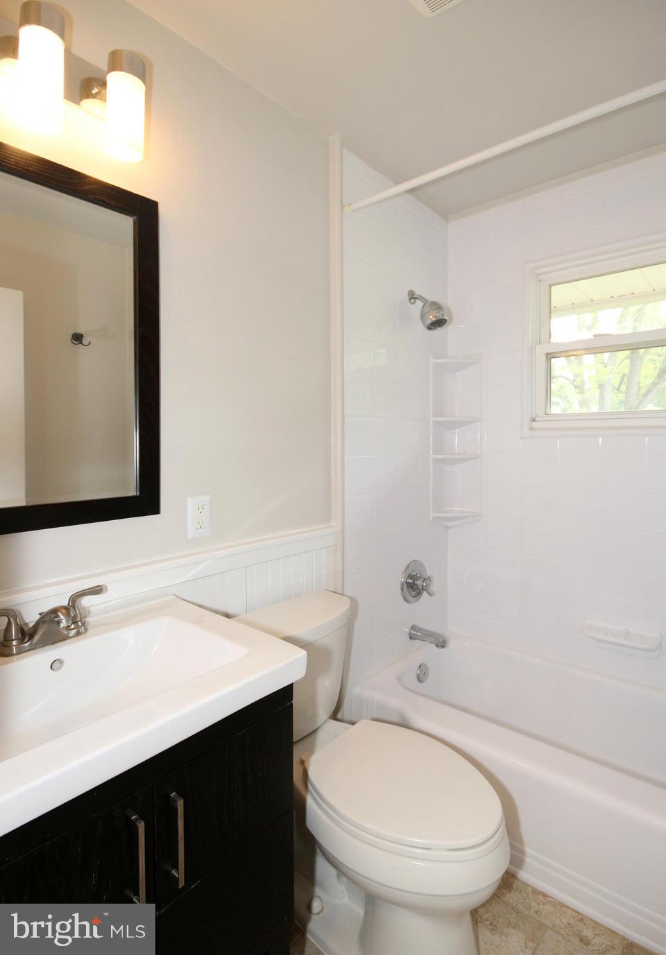 5216 Dalton Road Springfield, VA 22151 - Photo 21 of 27 a bathroom with a sink a toilet and shower