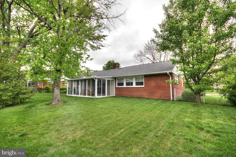 5216 Dalton Road Springfield, VA 22151 - Photo 26 of 27 a view of a house with a yard and a garden