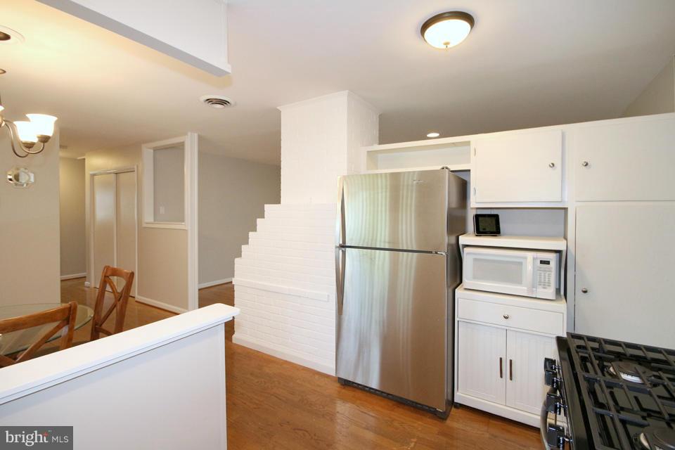5216 Dalton Road Springfield, VA 22151 - Photo 7 of 27 a kitchen with stainless steel appliances a refrigerator and a sink