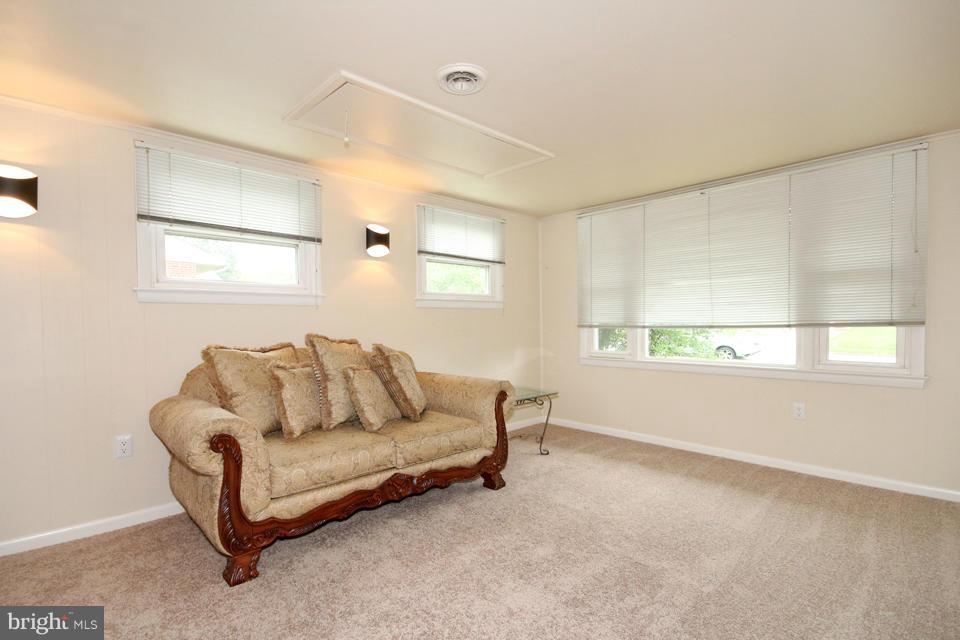 5216 Dalton Road Springfield, VA 22151 - Photo 8 of 27 a living room with furniture and a window
