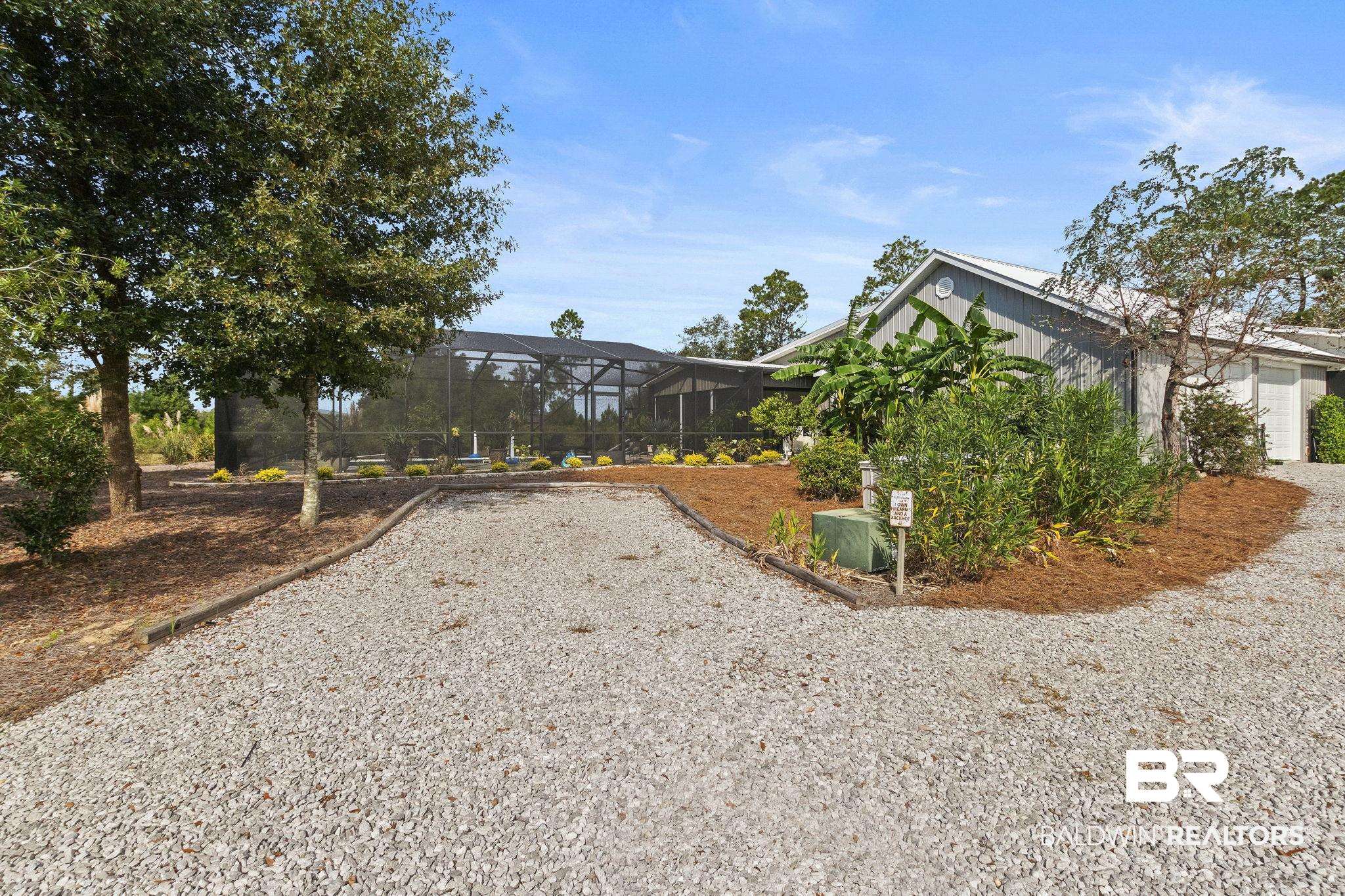 26071 Woerner Road Elberta, AL 36530 - Photo 54 of 86 Exterior space with a lanai and a garage