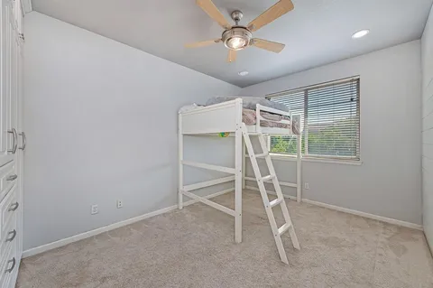 a bedroom with a bed and window