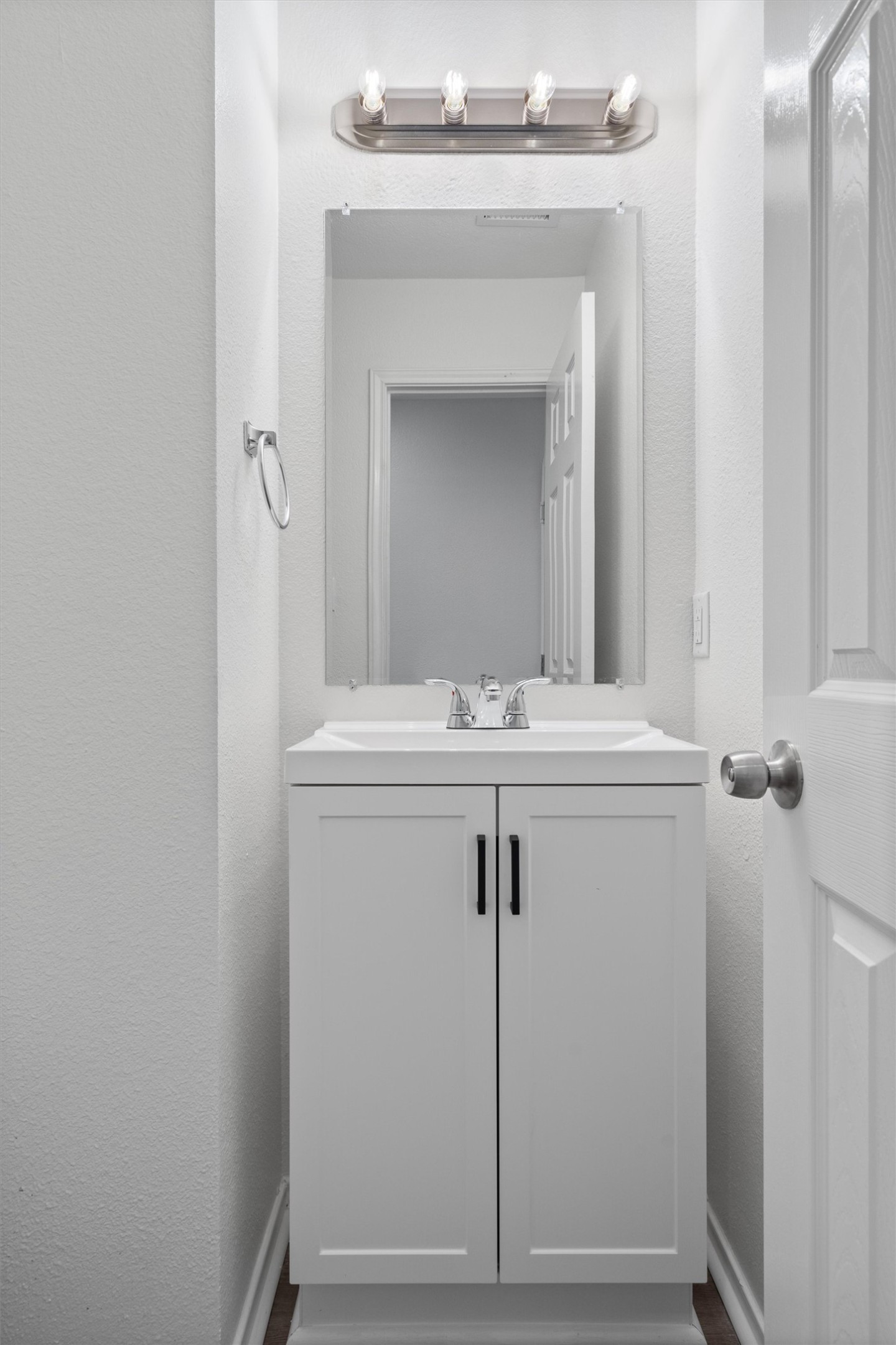 2101 Jester Farms Road Round Rock, TX 78664 - Photo 11 of 24 Bathroom featuring a textured wall and vanity