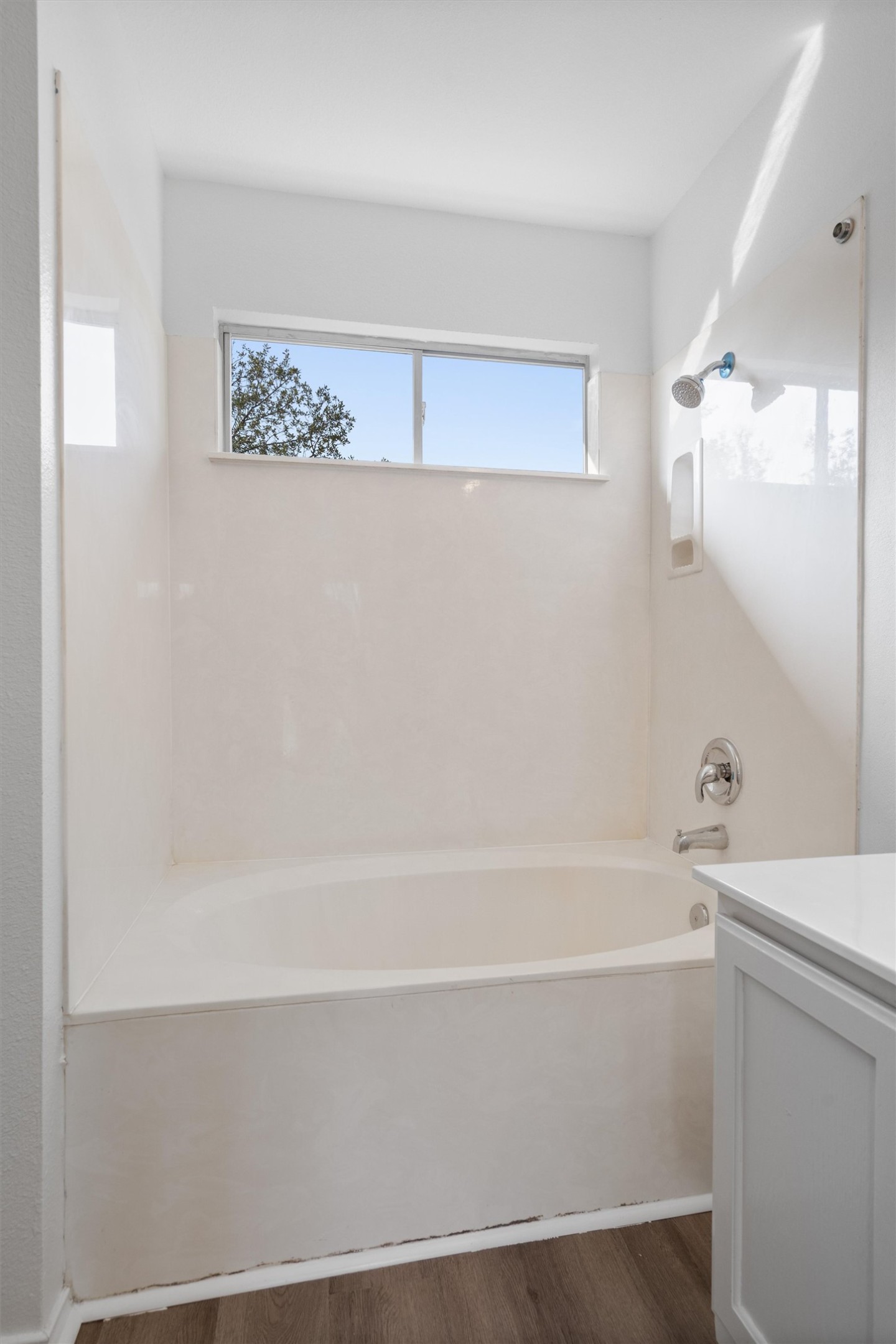 2101 Jester Farms Road Round Rock, TX 78664 - Photo 17 of 24 Bathroom with dark wood finished floors, vanity, and shower / washtub combination