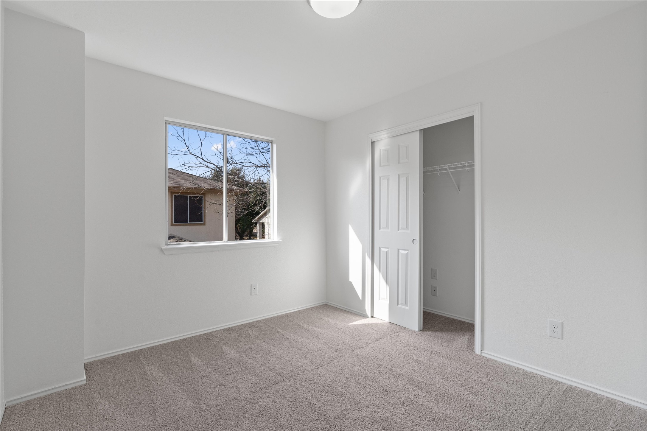 2101 Jester Farms Road Round Rock, TX 78664 - Photo 22 of 24 Unfurnished bedroom featuring carpet and a closet