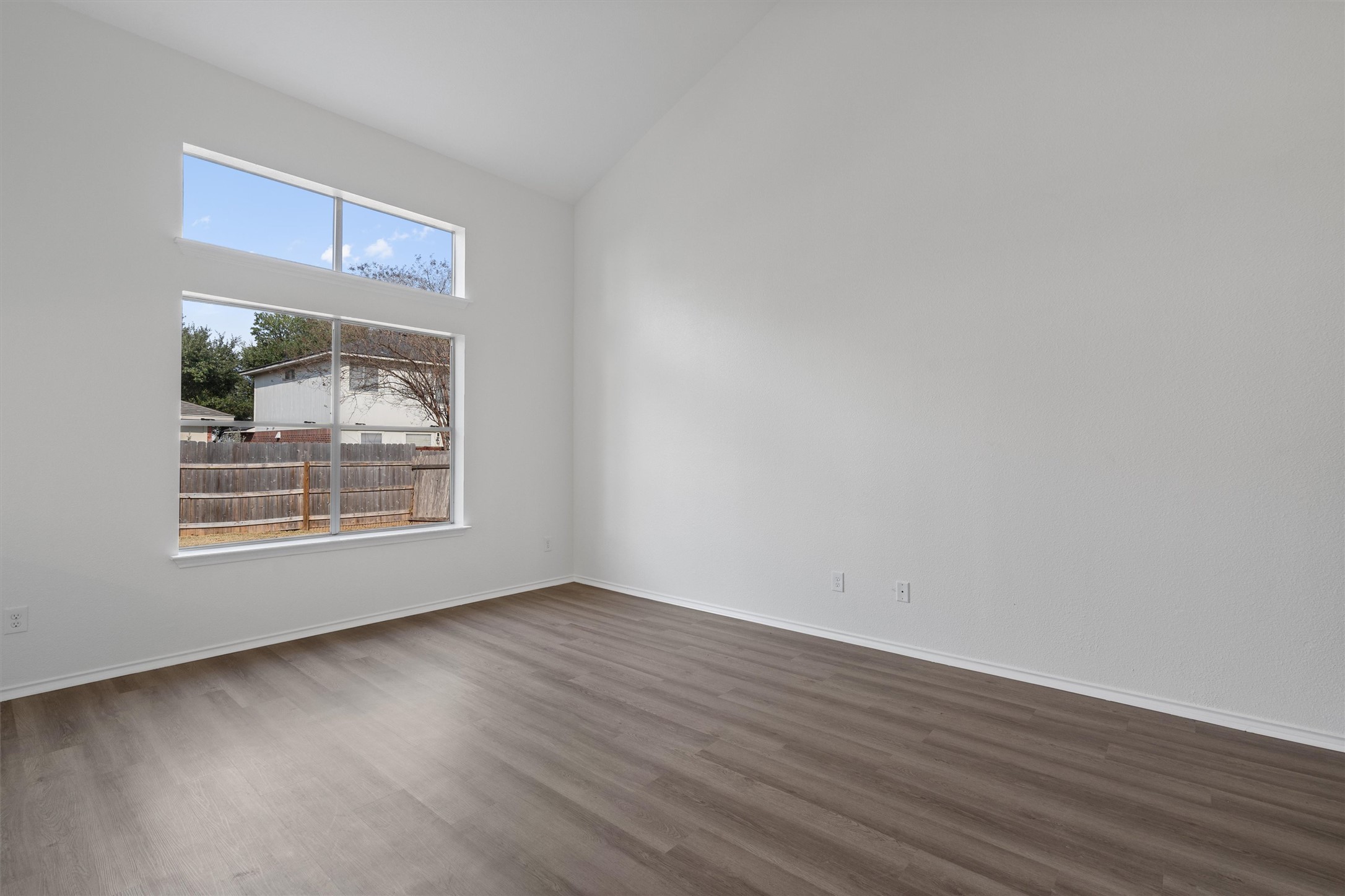 2101 Jester Farms Road Round Rock, TX 78664 - Photo 4 of 24 Spare room with dark wood-type flooring and high vaulted ceiling