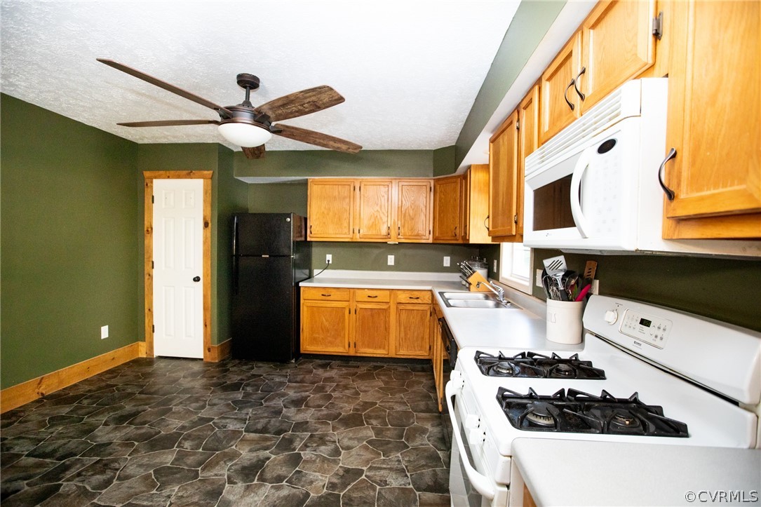 2232 Mt Pleasant Road Pamplin, VA 23958 - Photo 12 of 50 a kitchen with a refrigerator and a stove