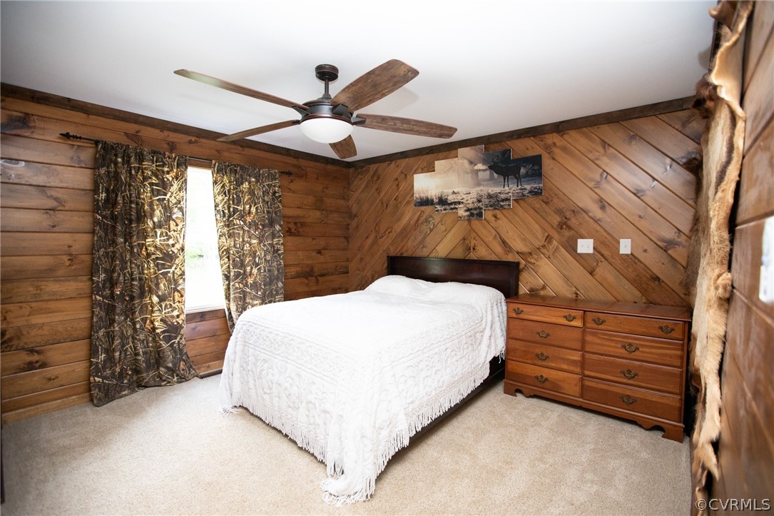 2232 Mt Pleasant Road Pamplin, VA 23958 - Photo 15 of 50 a bedroom with a bed and a chandelier