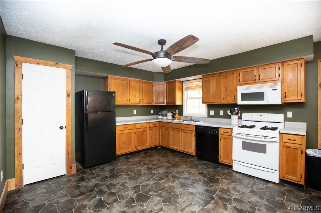 2232 Mt Pleasant Road Pamplin, VA 23958 - Photo 10 of 50 a kitchen with granite countertop a refrigerator stove top oven and sink