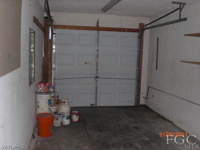 7429 Albany Road Fort Myers, FL 33967 - Photo 15 of 20 a room with water heater and wooden walls