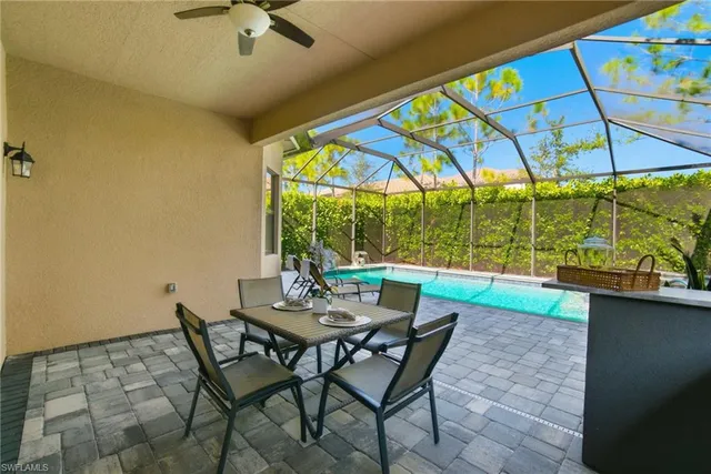 a view of a dining room with furniture and a window