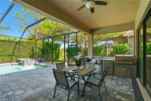 a view of a patio with a dining table and chairs