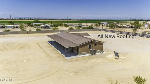 a view of a room that has a bed and a window
