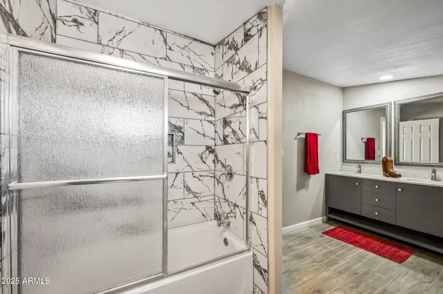 a view of workspace with wooden floor and windows