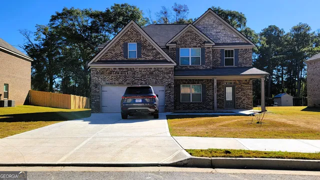 a front view of a house with yard