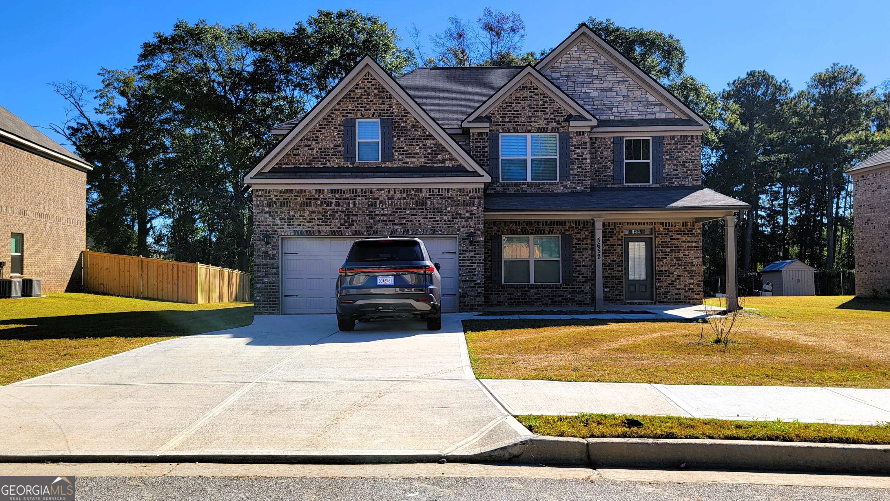 a front view of a house with yard