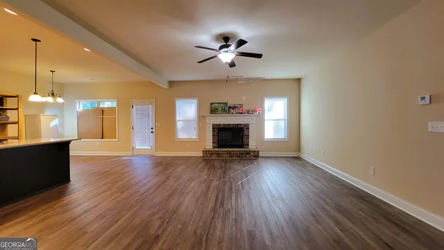 a kitchen with a sink a counter space cabinets and appliances