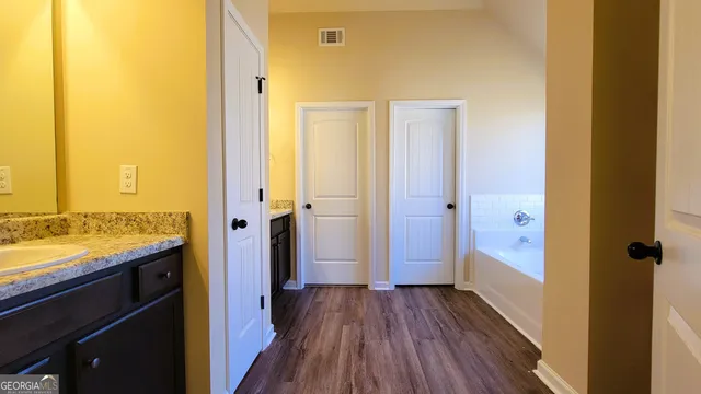 a view of bathroom with a wooden floor